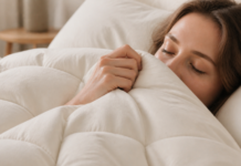 From Sleeping Badly to Sleeping Well: A Bedroom Upgrade Checklist in Order of Impact a down comforter with a linen shell